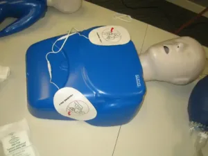 AED Trainer placed on CPR training mannequin